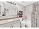 Cozy bathroom featuring a shower-tub combo, granite vanity, and a large mirror at 19804 Summerset Ln, Parker, CO 80138