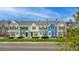 Beautiful townhomes featuring professionally landscaped yards, sidewalks, and tree-lined street at 19804 Summerset Ln, Parker, CO 80138