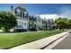 Charming street view showcasing townhomes with lush green lawns and inviting curb appeal at 19804 Summerset Ln, Parker, CO 80138