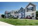 Charming townhomes featuring well-manicured lawns and inviting entrances, creating a welcoming curb appeal at 19804 Summerset Ln, Parker, CO 80138