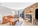 Inviting living room features a stone fireplace, hardwood floors, and access to a patio at 19804 Summerset Ln, Parker, CO 80138