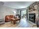 Comfortable living room featuring a stone fireplace and access to the outdoors at 19804 Summerset Ln, Parker, CO 80138
