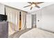 Main bedroom with a ceiling fan, and closet with soft closing drapes at 19804 Summerset Ln, Parker, CO 80138