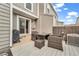 Private outdoor patio with wood fence, wicker furniture set, and room for grilling at 19804 Summerset Ln, Parker, CO 80138