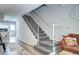 Carpeted staircase with white railing, leading to the upper level at 19804 Summerset Ln, Parker, CO 80138