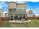Spacious backyard with a patio, outdoor furniture, and a well-maintained lawn at 10125 Zeno St, Commerce City, CO 80022