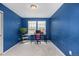 Bedroom with blue walls features plush carpet and natural light at 10125 Zeno St, Commerce City, CO 80022