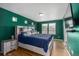 A primary bedroom features hardwood floors, ample natural light, and custom headboard at 10125 Zeno St, Commerce City, CO 80022