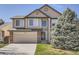 Charming two-story home featuring a two-car garage and well-maintained lawn at 237 Cherry St, Castle Rock, CO 80104