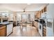 Spacious kitchen with tile floors, wooden cabinets, and adjacent dining area with natural light at 237 Cherry St, Castle Rock, CO 80104