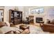 Cozy living room with a fireplace, large window, and comfortable leather furniture at 237 Cherry St, Castle Rock, CO 80104