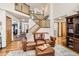 Spacious living area featuring an open staircase and stylish leather furniture at 237 Cherry St, Castle Rock, CO 80104