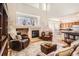 Bright living room boasts high ceilings, a fireplace, and open access to the kitchen at 237 Cherry St, Castle Rock, CO 80104