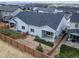 Aerial view of a backyard with fenced yard, small artificial turf, and a covered patio at 195 Silver Rock Trl, Castle Rock, CO 80104