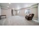 Spacious finished basement with neutral carpet, stairs, and egress windows that provide natural light at 195 Silver Rock Trl, Castle Rock, CO 80104