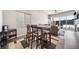 Bright dining area featuring a modern table set, stylish rug, and natural light from a large window at 195 Silver Rock Trl, Castle Rock, CO 80104