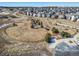 Aerial view of a charming dog park with walking paths, shelter, and enclosed fence at 195 Silver Rock Trl, Castle Rock, CO 80104