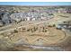 Aerial view of a community park with a winding walking trail and mature landscaping at 195 Silver Rock Trl, Castle Rock, CO 80104