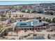 Aerial view of a community pool and clubhouse surrounded by residential homes at 195 Silver Rock Trl, Castle Rock, CO 80104