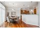 Charming dining area with a round table, seating for four, and hardwood floors near the kitchen at 10134 Bluffmont Ln, Lone Tree, CO 80124