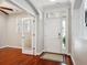 Bright entryway featuring hardwood floors, and an open layout connecting to other rooms at 10134 Bluffmont Ln, Lone Tree, CO 80124