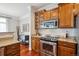 Elegant kitchen showcasing granite counters, stainless appliances, and custom wood cabinetry at 10134 Bluffmont Ln, Lone Tree, CO 80124