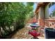 Paver patio with seating and lush greenery providing privacy and shade at 10134 Bluffmont Ln, Lone Tree, CO 80124