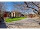 Backyard featuring artificial turf, a patio area, and decorative landscaping at 2317 Elmira St, Aurora, CO 80010