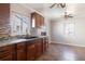 Beautiful kitchen with dark wood cabinets, granite counters, and a mosaic backsplash at 2317 Elmira St, Aurora, CO 80010