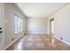 Cozy living room filled with natural light, showcasing tiled floors and neutral wall colors at 2317 Elmira St, Aurora, CO 80010