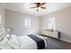 Comfortable bedroom with modern dresser, soft carpet, and bright natural light at 2317 Elmira St, Aurora, CO 80010