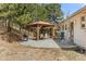Outdoor patio featuring a grill and gazebo, creating a perfect entertaining space in the backyard at 30313 Arena Dr, Evergreen, CO 80439