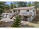 A charming home featuring a spacious deck, attached garage, and beautiful exterior at 30313 Arena Dr, Evergreen, CO 80439