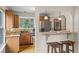 Well-lit kitchen with granite countertops, stainless steel appliances, and wooden cabinets at 30313 Arena Dr, Evergreen, CO 80439
