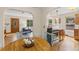 Charming kitchen features stainless steel appliances and hardwood floors with beautiful view of wooded area at 30313 Arena Dr, Evergreen, CO 80439
