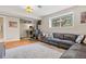 Comfortable living room with wood-burning stove, plush seating, and ample natural light at 30313 Arena Dr, Evergreen, CO 80439
