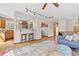 Bright living room with hardwood floors, bar seating, wooden cabinets, and stylish decor at 30313 Arena Dr, Evergreen, CO 80439