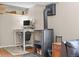 The living space has a cozy wood-burning stove, a desk area, and room for relaxation at 30313 Arena Dr, Evergreen, CO 80439