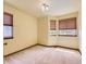 Bedroom with light walls, carpeted floor, and windows with blinds at 9412 La Quinta Way, Lone Tree, CO 80124