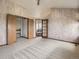 Large bedroom with ensuite bathroom and view of second story, offering neutral carpet and lots of light at 9412 La Quinta Way, Lone Tree, CO 80124