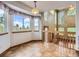 Bright breakfast nook with natural light, tile floors, and staircase at 9412 La Quinta Way, Lone Tree, CO 80124