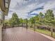 Expansive wooden deck with views of lush greenery and neighborhood at 9412 La Quinta Way, Lone Tree, CO 80124