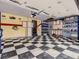 Organized garage featuring a checkerboard floor, storage cabinets, and utility sink at 9412 La Quinta Way, Lone Tree, CO 80124