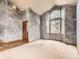 Living room featuring gray textured walls, carpet, and several windows providing ample natural light at 9412 La Quinta Way, Lone Tree, CO 80124