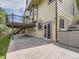 Backyard patio beneath a deck, with a hot tub and easy access via sliding doors at 9412 La Quinta Way, Lone Tree, CO 80124