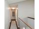 Bright hallway features modern railing and a neutral color scheme, creating a welcoming space at 1288 Gambel Oaks Dr, Elizabeth, CO 80107