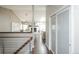 Open hallway showcasing the dining room, fireplace, and kitchen with modern finishes and hardwood floors at 1288 Gambel Oaks Dr, Elizabeth, CO 80107