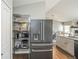 Stainless steel refrigerator and pantry in an open kitchen at 1288 Gambel Oaks Dr, Elizabeth, CO 80107