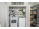 Laundry room with washer, dryer, shelving, and pantry next to the appliances at 1288 Gambel Oaks Dr, Elizabeth, CO 80107