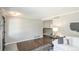 Open concept living space with hardwood floors, neutral decor, and seamless flow to other rooms at 1288 Gambel Oaks Dr, Elizabeth, CO 80107